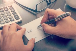 signing a check for alimony