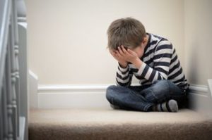 child crying on the staircase